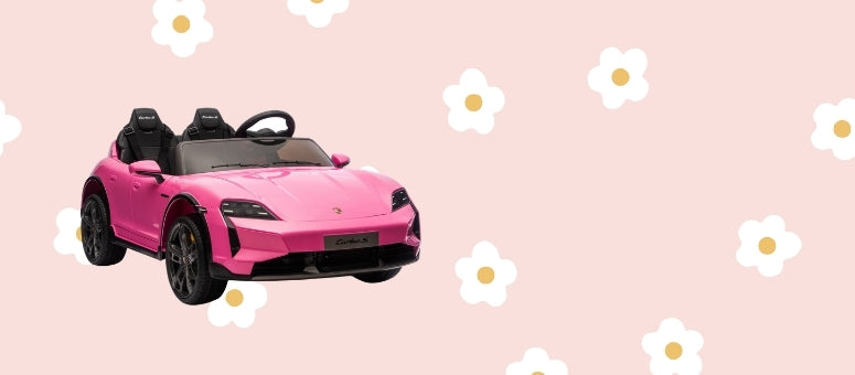A pink toy sports car with black wheels and a black interior, shown against a light pink background with white daisy illustrations.