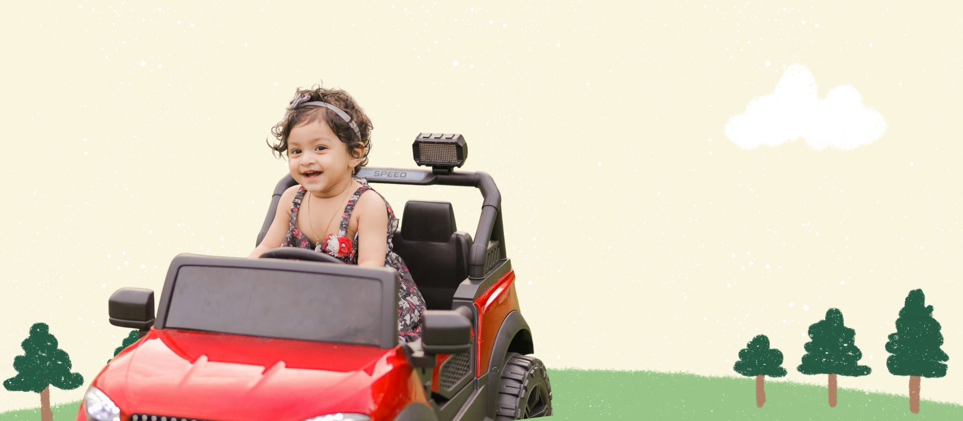 A young child wearing a floral dress sits smiling inside a red and black ride-on toy car against a light cream background with simple illustrated trees and a cloud.